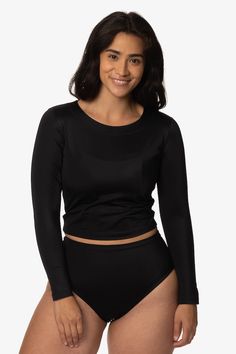 Protect your arms, shoulders, and chest protected from UV rays in the Freya long-sleeved cropped rashie. This top is meant to be used on land and sea with its quick-drying and soft-to-the-touch Surf-Tec Fabric. Flattering and form-fitting, the Freya pairs beautifully over any bikini top. This cropped long-sleeve rash guard is a surfer's dream. Keeping you going all day long, this swimsuit is carefully designed with our ultra-soft Surf-Tec fabric keeping you going all day long. Made for women wit Flattering Bathing Suit, Swim Shirts For Women, Cropped Rash Guard, Land And Sea, Swim Shirt, Rashguard Swimsuit, Long Sleeve Rashguard, Long Sleeve Swimsuit, Swim Shirts