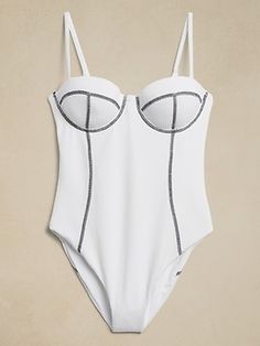 Crafted in a crepe-like textured fabric, the Valerie One-Piece is designed to flatter with underwire cups reinforced with light foam padding and contrast flatlock seams throughout.  ONIA: Minimal and meticulously crafted, New York-based Onia was foun Underwire Bodysuit With Built-in Bra For Poolside, Compressive Underwire Swimwear With Smoothing Detail, White Lined One-piece Swimwear For Pool, One-piece Ruffled Swimwear For Pool, Beachwear One Piece With Built-in Bra For Pool, Be Soft, Luxury Swimwear, Textured Fabric, Banana Republic