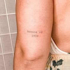 a man with a tattoo on his arm that reads benca v's 1950