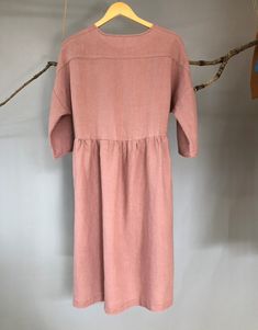 "Made from medium weight linen, this dress is very soft and swings comfortably, allowing movement in all the right places. Buttoned front and loose fit design, it will be a staple in your wardrobe for a long time to come. -100% linen construction -Below the knee length (or to be customized per request) -3/4 sleeves ( or to be customized per request) -Half front closure with buttons -Gathered waist -Two side pockets - Listing Colors: Grayish Blue, Blush, Amber, Teal Please provide your shoulder w Spring Daywear Mid-length Linen Dress, Spring Mid-length Linen Dress For Daywear, Linen Midi Dress For Daywear, Spring Linen Midi Dress, Knee-length Linen Midi Dress For Daywear, Short Sleeve Linen Midi Dress For Fall, Spring Linen Buttoned Dress, Relaxed Fit Midi Linen Dress For Daywear, Relaxed Fit Midi Dress With Buttons