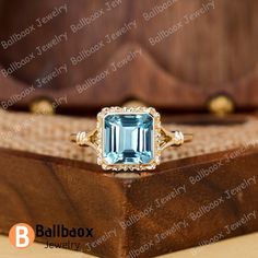 "MADE TO ORDER * Material: Solid gold(10K/14K/18K white/yellow/rose gold), Platinum, 925 Sterling Silver * DETAILS - Center Stone: Natural Blue Topaz - Center Stone Size: Radiant Cut 8*8mm - Center Stone  Carat Weight: Approx 3.0ct - Band Width: 1.6 mm * Click on the \"Pin It\" icon if you like this item ✥ O T H E R ∙ I N F O R M A T I ON ✥ ♦ Your item will be nicely packed to gift in elegant jewelry boxes. ♦ Custom Order We can make custom rings in almost any shape and style. If you want a specific model, please send us a clear picture and we will do our best. ♦ Shipping Most items take 3-4 weeks to create.I'm happy to rush your order, fees may apply, write me for details. ♦ Payment Plans I offer payment plans. The minimum per payment will be $100. Write me your finger size, metal color, Blue Gemstone Ring, Ring Square, Gift Luxury, Blue Gemstone Rings, Square Ring, Ring Art Deco, Twist Ring, Square Rings, Deco Ring