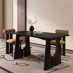 a black table with two chairs and a vase on top of it in a room