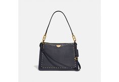 Dreamer Shoulder Bag With Rivets | Stuart Weitzman Coach Shoulder Bag With Adjustable Strap For Fall, Coach Shoulder Bag For Work With Zipper Closure, Coach Bag With Leather Trim For Fall, Coach Bags With Leather Trim For Fall, Fall Crossbody Shoulder Bag With Metal Hardware, Coach Shoulder Bag With Textured Leather For Fall, Coach Textured Leather Shoulder Bag For Fall, Fall Travel Shoulder Bag With Metal Hardware, Fall Leather Trim Crossbody Shoulder Bag