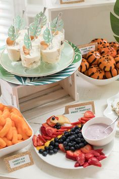 an assortment of desserts and snacks displayed on plates