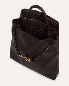 Bottega Veneta "Andiamo" tote bag in silky calf leather     Top handle     Sliding shoulder strap with knot hardware accent     Can be worn as a top handle or shoulder bag     Open top with magnetic closure     Interior, one zip pocket and two slip pockets     Lining: Suede    Feet protect bottom of bag     Approx. 9.8"H x 12.5"W x 4.3"D    Made in Italy Designer Shoulder Bag With Rolled Handles For Daily Use, Designer Shoulder Bag With Double Rolled Handles, Designer Shoulder Bag With Double Handles, Elegant Satchel Shoulder Bag With Rolled Handles, Luxury Hobo Bag With Top Handle, Luxury Shoulder Bag With Rolled Round Handles, Luxury Calf Leather Hobo Tote Bag, Luxury Double Handle Shoulder Bag With Rolled Handles, Luxury Brown Hobo Bag With Rolled Handles