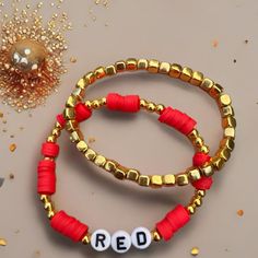 two red and gold beaded bracelets with the word red spelled out on them