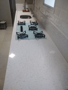 a kitchen counter top with four burners on it