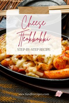 a skillet filled with shrimp and cheese on top of a wooden table next to chopsticks