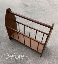 a wooden bed frame sitting on top of cement