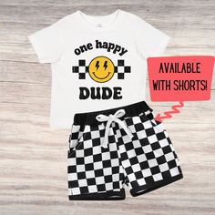 a white shirt and checkered shorts with the words, one happy dude on it