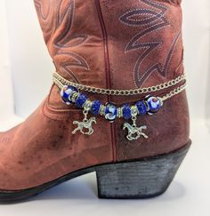 Boot bling! Cute little horses dancing on a chain with dark blue beads and silver accents.  Adjustable from 14" - 16". Blue Beaded Chain Bracelets For Party, Adjustable Blue Bracelets With Dangling Beads, Blue Beaded Bracelets With Dangling Beads For Gift, Horses Dancing, Shoe Bracelet, Chain Crafts, Cowgirl Things, Boot Charms, Western Jewellery