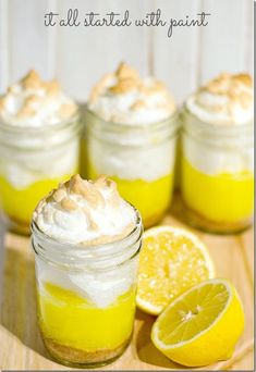 there are lemons and marshmallows in mason jars