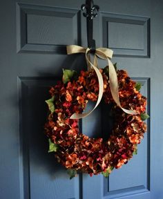 a wreath is hanging on the front door