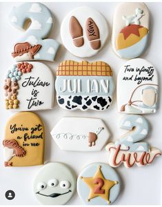 decorated cookies are arranged in the shape of letters, numbers, and symbols for children's birthdays