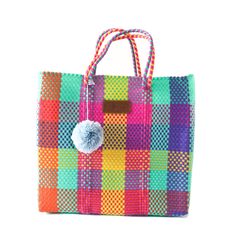 "Handwoven by artisans in Mexico using 100% recycled plastic our totes are the perfect go-to for all occasions. Take your bag from the gym, to work, to a beach day, and a stroll around town while carrying all your essentials in this lightweight stylish tote. Crafted from ethically sourced high-quality materials this bag is durable, flexible, and waterproof, made to last for years. Our redesigned Totes now have a detachable nylon pouch with zipper closure that fits your phone, wallet, or anything Everyday Multicolor Woven Beach Bag, Multicolor Recyclable Beach Bag For Vacation, Eco-friendly Square Multicolor Beach Bag, Eco-friendly Multicolor Square Beach Bag, Packable Multicolor Rectangular Bag, Multicolor Tote Bag Made From Recycled Plastic, Multicolor Rectangular Bag Made Of Recycled Materials, Reusable Multicolor Rectangular Beach Bag, Multicolor Bags Made Of Recycled Materials For Everyday Use