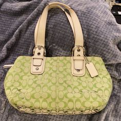 Nwot And Perfect Condition Adorable Green And White Coach Purse With The Coach Signature Cs Throughout. Perfect Condition! I Bought Because I Love Green But Just Never Carried It Because I Started Carrying Mini Backpack Purses Instead. Held Onto It For A While Because I Love It So Much But Will Probably Never Use A Real Purse Again. It’s A Perfect Medium Size Bag And So So Cute! Smoke Free Home. Like It? Make An Offer Or Ask Any Questions. Thank You! Coach Designer Green Bag, Green Rectangular Coach Bags, Coach Green Shoulder Bag For Shopping, White Coach Purse, Green Coach Purse, Green Coach Shoulder Bag With Gold-tone Hardware, Backpack Purses, I Love Green, Rhinestone Jeans