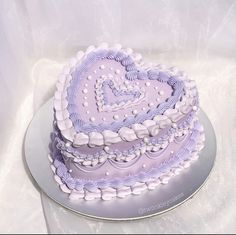 a heart shaped cake sitting on top of a table