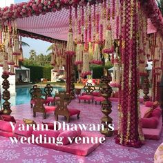 the wedding venue is decorated in pink and gold