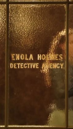 the front cover of an enola holles's book, with words on it