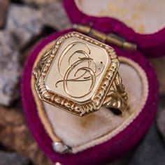 This antique signet ring features the initials "OO" in script on the rectangular shaped top. The shoulders are decorated with beautiful scrolling and patina. The ring is crafted in 14k yellow gold and is a size 10.5. We are not offering resizing due to the hand engraved inscription on the inside if the shank that reads "Minnie Fira Reidar de Wenke." Luxury Antique Signet Ring With Brilliant Cut, Luxury Vintage Diamond Cut Signet Ring, Luxury Engraved Victorian Signet Ring, Signet Ring Initials, Classic Rectangular Signet Ring Stamped 14k, Rectangular 14k Stamped Signet Ring Collectible, 14k Gold Engraved Ring With Initials For Collectors, Gold Victorian Signet Ring With Maker's Mark, Yellow Gold Antique Signet Ring With Maker's Mark