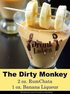 the dirty monkeyy cocktail is served in a martini glass with banana slices on top