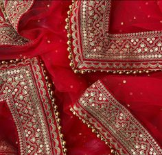 This gorgeous Bridal Red Embroidered Stone Net Dupatta comes with a traditional and festive tone. To enhance this, a detailed embroidered border in silk with stone and zari embroidery is added on the edges. This net stone work embroidered dupatta from anokherang is sure to make heads turn this season. SPECIFICATIONS: Material : Net Work type : Stone Pattern Type : Embroidered  Color : Red Length : 2.5 m Width : 1.25 m Danglers : None Care: Dry clean only Traditional Red Sets With Gota Work, Wedding Festive Dupatta With Intricate Embroidery, Festive Wedding Dupatta With Intricate Embroidery, Traditional Embroidered Dupatta For Wedding, Kundan Dupatta For Traditional Ceremonies At Eid, Traditional Wedding Salwar Kameez With Zari Work, Kundan Dupatta For Traditional Ceremonies During Eid, Eid Kundan Dupatta For Traditional Ceremonies, Traditional Salwar Kameez With Zari Work For Weddings