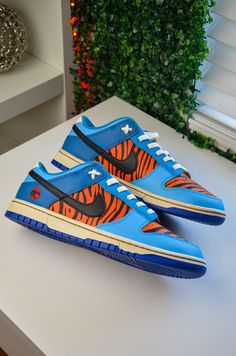 Custom made Thundercats Tygra dunks.  Sneakers are 100% authentic Nike Dunks, while the design has been painted with acrylic leather paints.  The sneakers are a size  US 11.5 mens. Custom Dunks, Jordans Pink, Dunks Sneakers, Shoe Concept, Sneaker Ideas, Nike Collection, Air Sneakers, Urban Shoes, Custom Painted Shoes