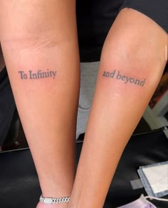 two people with matching tattoos on their legs that say to infinity and beyond