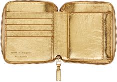 Crinkled leather wallet in metallic gold tone. · Zip closure · Logo embossed at interior · Press-stud coin pouch · Patch pocket · Four card slots · One note slot · H3.75 x W4.5 x D0.75 Supplier color: Gold Designer Gold Bifold Wallet, Classic Gold Leather Coin Purse, Classic Gold Bifold Coin Purse, Luxury Gold Leather Wallet, Designer Gold Wallet With Card Slots, Designer Gold Wallets With Card Slots, Luxury Gold Wallets For Travel, Luxury Gold Wallet For Travel, Luxury Gold Bifold Wallet