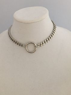 Silver Curb Link Chain Necklace-Cuban Chain Choker-Chain Choker-Silver Chain Necklace-Chunky Necklace-Spring Lock Connector-Silver Carabiner This is a high quality thick, brass, Rhodium plated chain necklace. Minimalist and modern chunky silver curb link chain necklace with a decorative spring lock connector. The curb/cuban link necklace is is a show stopper jewel and is a weighty brass necklace. Lead safe and Nickel safe. You have the option of adding your own pendant or enhancer to the connect Silver Chain Link Ring Made Of Metal, Silver Metal Chain Link Ring, Silver Sterling Silver Chain Ring, Sterling Silver Chain Ring In Silver, Silver Chain Metal Ring, Silver Jewelry With Curb Chain And Round Pendant, Silver Chunky Chain Round Jewelry, Silver Jewelry With Chunky Chain, Silver Jewelry With Round Chunky Chain