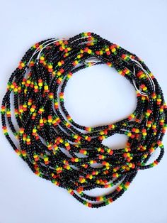 Guyana🇬🇾 flag waist beads These waist beads are cotton string tie arounds to track your weight and are permanent until they are cut off your body. How do you know you are losing weight without weighing often? The waist beads will begin loosen as you lose weight. They will start to hang down. Make sure before tying that there is a bit of wiggle room for comfort. Multicolor Waist Beads With Large Beads For Festival, Multicolor Large Beaded Waist Jewelry For Festival, Round Black Beads For Festival, Elegant Black Round Beads For Festivals, Multicolor Large Beaded Waist Beads For Festival, Festival Black Round Beads, Black Round Beads For Festival, Adjustable Multicolor Waist Beads With Large Beads, Adjustable Hand-strung Waist Beads For Festivals