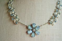 Once a Vintage blue bracelet, inspired and transformed into  into a new assemblage necklace.  Fairly-like, curious findings of silver and white tiny leaves and petals mingle with powder blue rhinestones, joined to perfect flower petals.  Simply gorgeous.Completely hand crafted and truly one of a kind.  Layaway available.Length: 24 inches.  Comes with a 3" extender chain.  Large lobster claw closure.**Note - These are vintage pieces and have been deemed to be in very good vintage condition. Since Vintage Assemblage Necklace, Vintage Assemblage, Assemblage Necklace, Assemblage Jewelry, Wide Bracelet, Choker Style, Necklace Blue, Blue Necklace, Blue Rhinestones