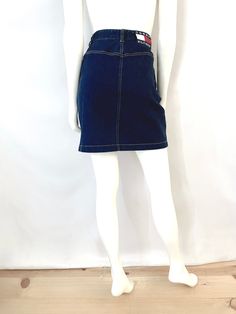 Vintage 90's Tommy Hilfiger, Denim Skirt (Size 8) This 90's Skirt comes in a dark blue denim with gold stitching, three front pockets, belt loops and signature Tommy logo on the back. *There is slight stretch. 97% Cotton 3% Other Made in Hong Kong *This skirt is in excellent condition. *Free shipping in the US, and will go Priority Mail for a quick delivery! Size: (M) Modern Day 8 (Tag Size: 8) Waist: 29" Hips: 38" Length: 22" Weight: 15 oz *Follow FreshandSwanky on Instagram Tommy Hilfiger Vintage, Tommy Hilfiger Jeans, Jeans Rock, Priority Mail, Denim Skirt, Hong Kong, Blue Denim, Tommy Hilfiger, Dark Blue