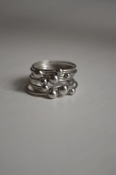 This set has 9 silver stacked rings. One of a kind. Size 6 1/2 They are already made and ready to ship. Stacked Sterling Silver Rings, Modern Sterling Silver Stackable Bands, Modern Stackable Sterling Silver Bands, Silver Stacked Jewelry Gift, Adjustable Stacked Sterling Silver Jewelry, Silver Stacked Midi Rings As A Gift, Modern Silver Stackable Bands, Modern Stackable Silver Bands, Unique Stackable Rings For Everyday