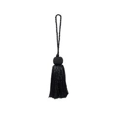 a black tasselled keychain on a white background