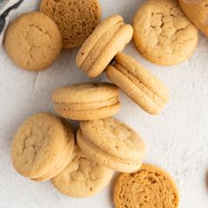 a pile of cookies sitting on top of a white table