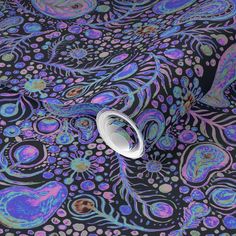 an image of a purple and blue wallpaper with circles, dots and swirls