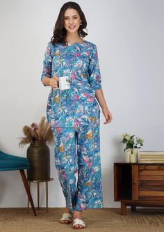 Embrace elegance and comfort with our Flowing Abstract on Blue Cotton Loungewear Dress. This sophisticated two-piece outfit features a flowing abstract design on soft, breathable cotton, perfect for summer. This top and pants suit transitions effortlessly from casual to chic loungewear, ideal for women who value style and ease. 🧵 Quality: Our Loungewear Set is made from 100% premium cotton, ensuring maximum softness and breathability. The fabric feels gentle against the skin, making it ideal for a restful night's sleep or a relaxed day at home. The set features a classic cut and durable stitching for long-lasting comfort. ⏳ Production Time: Please note that each loungewear set is made to order with a 1-3 days lead time for production. This ensures that you receive a fresh, high-quality pr Blue Floral Print Palazzo Set For Spring, Spring Blue Floral Print Palazzo Set, Blue Cotton Sets With Long Pants, Blue Long Sleeve Sets With Set-in Sleeves, Cotton Workwear Sets With Long Pants, Blue Fitted Sets With Long Pants, Blue Loungewear Sets With Long Pants, Blue Cotton Palazzo Set With Floral Print, Blue Pant Set For Spring Workwear