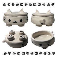 three ceramic bowls with cats faces and paws on the top one has a cat's head