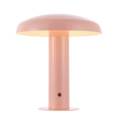 a pink table lamp sitting on top of a white surface