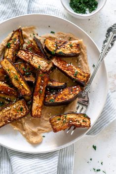 grilled eggplant on pita bread with parsley garnishes