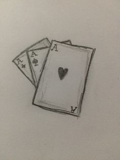 two playing cards with a heart drawn on them