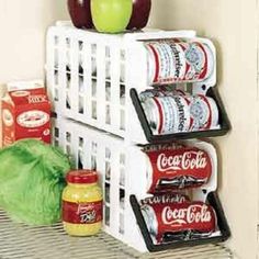 an apple sits on top of a shelf next to other food items and condiments