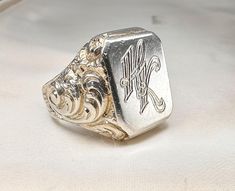 Massive 1930s antique silver German signet ring, with initials 'HK' or 'KH' engraved, marked '800' for silver, the ring is in good condition. Box on the photos not included! Material: 000 silver Weight: 27.8 g US size: 10 (EU 62) Luxury Antique Silver Signet Ring, Heirloom Engraved Signet Ring For Memorial, Heirloom Memorial Engraved Signet Ring, Classic Engraved Signet Ring For Memorial, Vintage Engraved Signet Ring For Memorial, Vintage Hallmarked Rings For Memorial, Antique Engraved Ring For Memorial, Vintage White Gold Sterling Silver Signet Ring, Heirloom Style Hallmarked Engraved Ring For Memorial