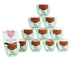 six boxes of tiny melies are stacked on top of each other in the shape of a pyramid