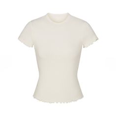 Skims Logo Pointelle T-Shirt W. Ruffle Edge *New With Tags* Description: Ruffle Edge On Bottom Hem, Standard Length Color: Marble Fabric: 96% Cotton/ 4% Spandex Fit: Model Is Size 2 And 5' 10”, Wearing Skims S White Fitted Top With Ruffles, Chic White Stretch T-shirt, Fitted White Short Sleeve Top For Spring, White Ruffled Crew Neck T-shirt, White Ruffled Short Sleeve T-shirt, Chic White Fitted T-shirt, Chic Stretch White Short Sleeve Top, Chic White Stretch Short Sleeve Top, Chic White Fitted Top T-shirt