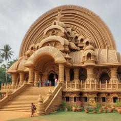 an intricately carved building with steps leading up to it