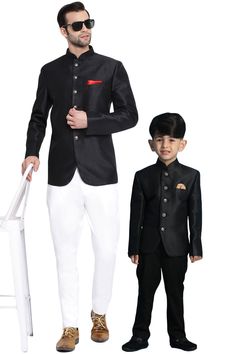 VASTRAMAY Black Silk Blend Solid Baap Beta Jodhpuri Set Look dapper in this black silk blend jodhpuri set from Vastramay. Perfect for special occasions, this set includes a jacket and pants for both father and son. Features Black, woven design Regular fit Mandarin collar Long sleeves Full button placket One welt pocket Straight hem Includes pocket square Specifications Sleeve Length: Long sleeves Top Shape: Regular Top Hemline: Straight Neck: Mandarin Material & Care Material: Silk Blend Care: D Black Nehru Jacket For Ceremonial Festivals, Black Festive Kurta For Ceremonial Occasions, Traditional Black Bandhgala For Festivals, Black Nehru Jacket For Ceremonial Festive Occasions, Black Bandhgala For Ceremonial Occasions And Festivals, Black Formal Suits For Eid, Elegant Black Nehru Jacket For Diwali, Black Long Sleeve Bandhgala For Festivals, Black Kurta For Ceremonial Occasions Like Eid