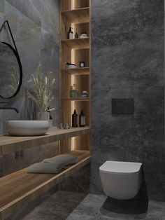 a modern bathroom with stone walls and flooring