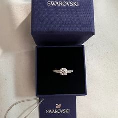 Swarovski Crystal Attract Ring Size 5.5. Brand New With Tag. Offers Welcome! See Our Photos For Details. Item #05759862 From Swarovski, This Ring Features: Swarovski's Attract Round Ring Is A Truly Romantic Gift. This Stunning, Rhodium-Plated Ring Features A Round Crystal In The Center With Sparkling Crystals On Either Side. The Crystals Embellish The Front Half Of The Ring. The Perfect Jewelry Piece For Day Or Evening Outfits! Rhodium-Plated Metal Swarovski Crystal Swarovski Promise Ring, Dainty Wedding Ring Silver, Swarovski Ring Aesthetic, Swarovski Ring Engagement, Swarovski Jewelry Aesthetic, Swarovski Rings, Girlfriend Proposal, Graduation Ring, Swarovski Jewelry Rings